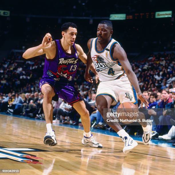 Joe Dumars of the Detroit Pistons dribbles during a game played on March 19, 1997 at the Palace of Auburn Hills in Auburn Hills, Michigan. NOTE TO...