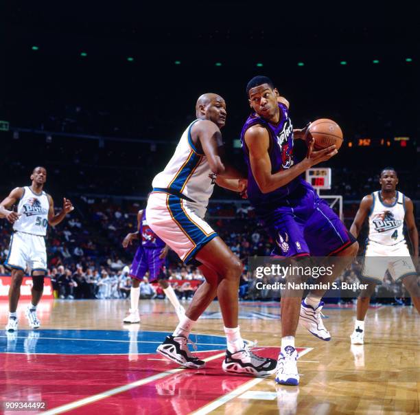 Marcus Camby of the Toronto Raptors drives during a game played on March 19, 1997 at the Palace of Auburn Hills in Auburn Hills, Michigan. NOTE TO...