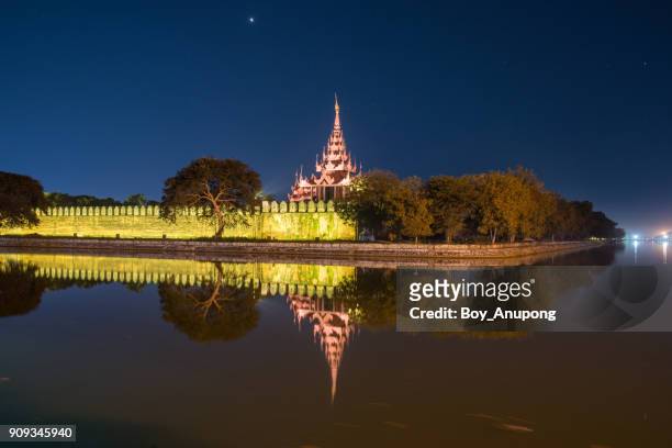 the scenery view of the moat and walls of mandalay fort at night. - mandalay fort stock pictures, royalty-free photos & images