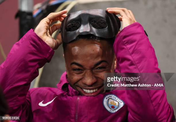 Raheem Sterling of Manchester City wearing a face mask from Eliaquim Mangala of Manchester City during the Carabao Cup Semi-Final: Second Leg between...