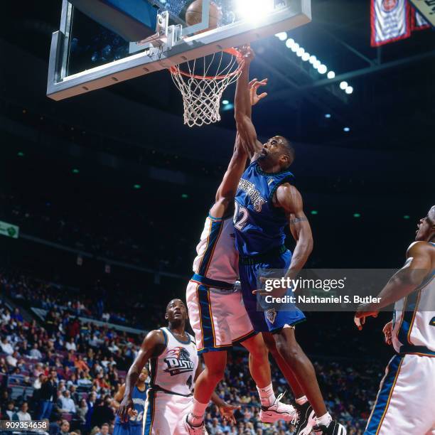 Dean Garrett of the Minnesota Timberwolves dunks during a game played on March 21, 1997 at the Palace of Auburn Hills in Auburn Hills, Michigan. NOTE...