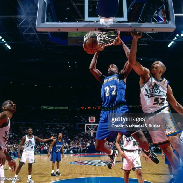 Dean Garrett of the Minnesota Timberwolves dunks during a game played on March 21, 1997 at the Palace of Auburn Hills in Auburn Hills, Michigan. NOTE...