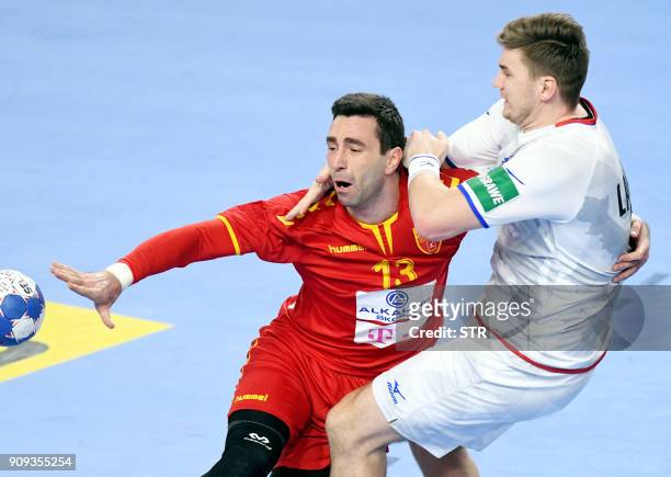 Macedonia's Filip Mirkulovski vies with Czech Republic's Jan Landa during the group II match of the Men's 2018 EHF European Handball Championship...
