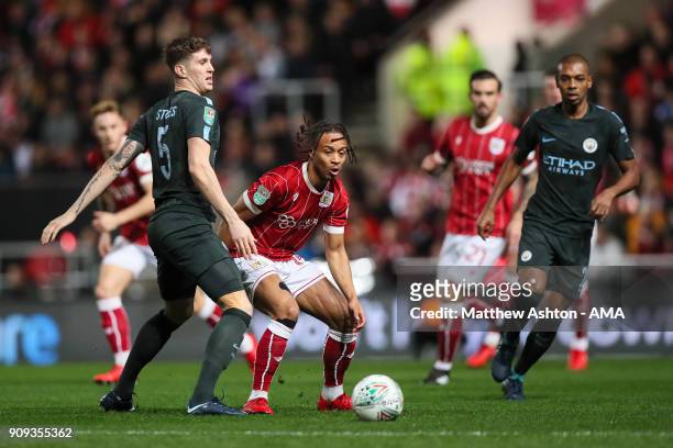 John Stones of Manchester City and Bobby Reid of Bristol City during the Carabao Cup Semi-Final: Second Leg between Bristol City and Manchester City...