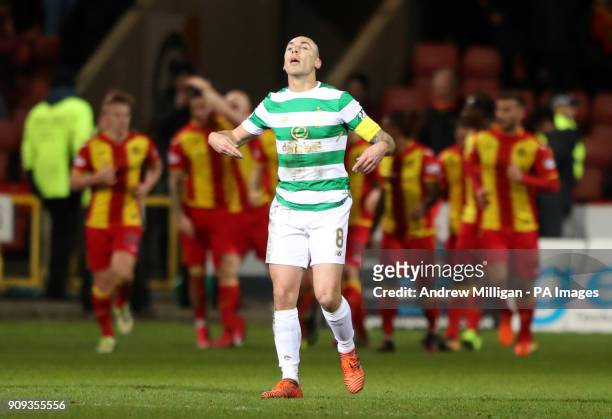 Celtic's Scott Brown reacts as Partick Thistle celebrate their sides first goal during the Ladbrokes Premiership match at Firhill Stadium, Glasgow.