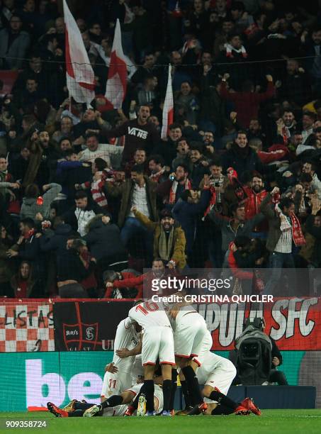 Sevilla's players celebrate a goal during the Spanish 'Copa del Rey' quarter-final second leg football match between Sevilla FC and Club Atletico de...