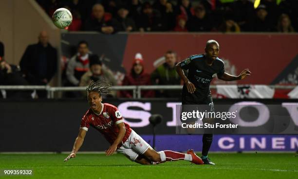 City player Fernandinho challenges Bobby Reid of Bristol City during the Carabao Cup Semi-Final: Second Leg match between Bristol City and Manchester...