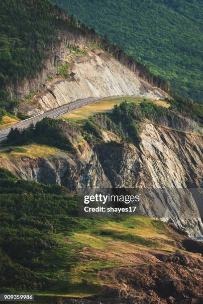 cabot trail highway cliff - cape breton island stockfoto's en -beelden