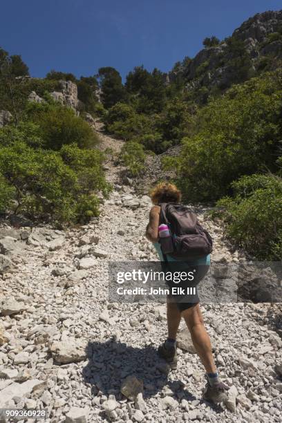 woman hiking calanque trail - calanques stock pictures, royalty-free photos & images