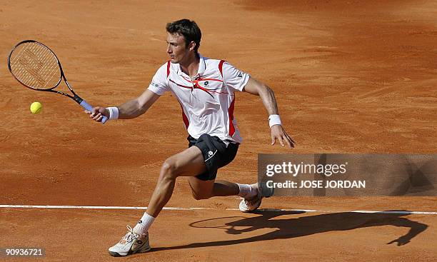 Spanish Juan Carlos Ferrero returns the ball to Israeli Dudi Sela during the second match of the Davis Cup semi-final tie between defending champions...