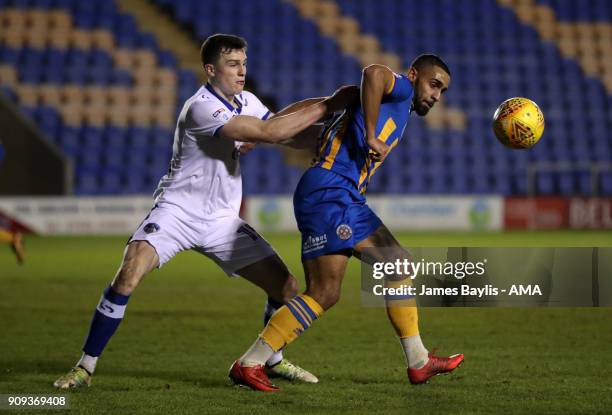 George Edmundson of Oldham Athletic and Stefan Payne of Shrewsbury Town during the Checkatrade Trophy match between Shrewsbury Town and Oldham...