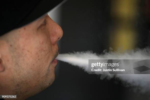 Jeremy Wong blows vapor from an e-cigarette at The Vaping Buddha on January 23, 2018 in South San Francisco, California. According to a 600 page...