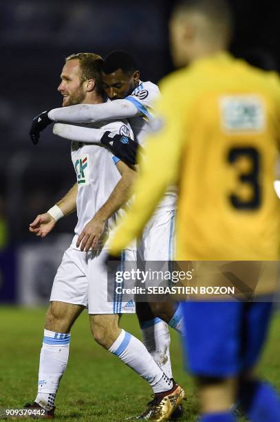 Olympique de Marseille's French forward Valere Germain is congratulated by teammates after scoring a goal during the French Cup football match...