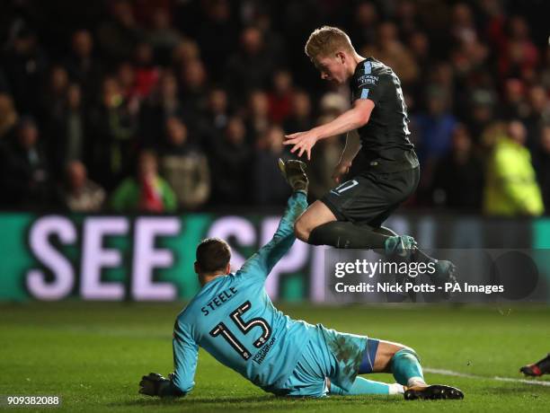 Manchester City's Kevin De Bruyne beaten Bristol City goal keeper Luke Steele to score his side's third goal of the game during the Carabao Cup semi...