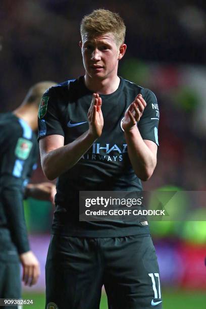 Man of the match Manchester City's Belgian midfielder Kevin De Bruyne applauds supporters on the pitch as they celebrate after the English League Cup...