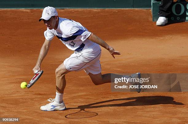 Israeli Dudi Sela returns a ball against Spanish Juan Carlos Ferrero during the second match of the Davis Cup semi-final tie between defending...