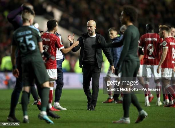 Manchester City manager Pep Guardiola shakes hands with Bristol City's Korey Smith after the Carabao Cup semi final, second leg match at Ashton Gate,...