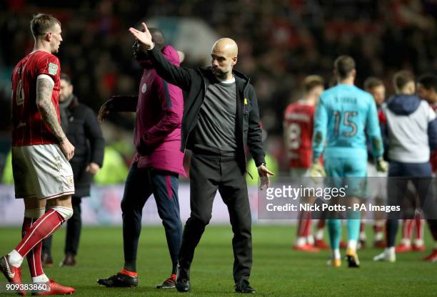 Manchester City manager Pep Guardiola gestures to the fans after the Carabao Cup semi final, second leg match at Ashton Gate, Bristol.