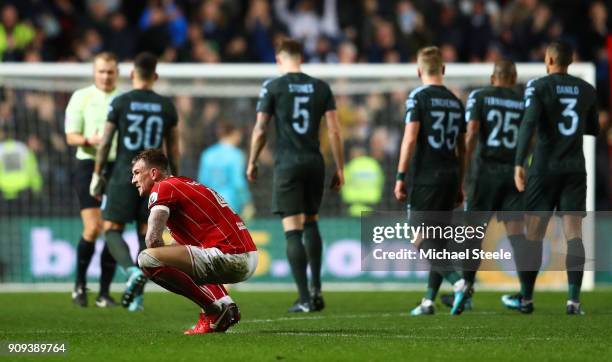 Aden Flint of Bristol City looks dejected in defeat after the Carabao Cup semi-final second leg match between Bristol City and Manchester City at...