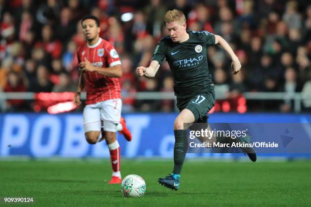 Kevin De Bruyne of Manchester City in action with Korey Smith of Bristol City during the Carabao Cup Semi-Final 2nd leg match between Bristol City...