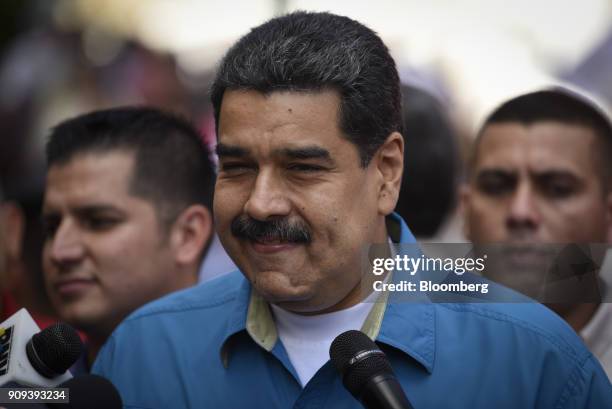 Nicolas Maduro, Venezuela's president, smiles while speaking to members of the media during a rally in Caracas, Venezuela, on Tuesday, Jan. 23, 2018....
