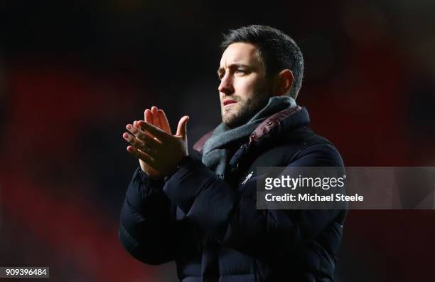 Lee Johnson, manager of Bristol City applauds the crowd after the Carabao Cup semi-final second leg match between Bristol City and Manchester City at...