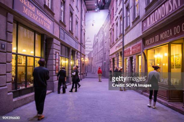 Visitors walk inside a exhibit room of post war streets of Poland at the World War 2 Museum. The world war 2 museum in the Polish city of Gdansk was...