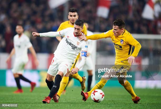 Kevin Gameiro of Atletico Madrid duels for the ball with Sergio Escudero of Sevilla FC during the Copa del Rey, Quarter Final, second Leg match...