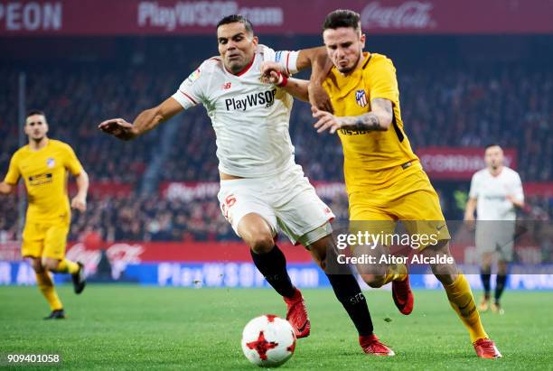 Saul Niguiz of Atletico Madrid duels for the ball with Gabriel Mercado of Sevilla FC during the Copa del Rey, Quarter Final, second Leg match between...