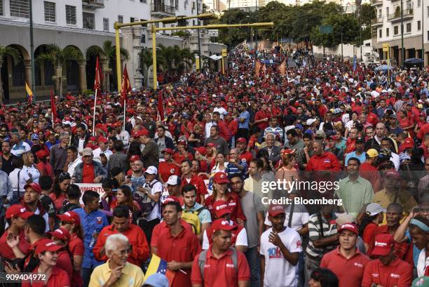 Attendees stand during a rally with Nicolas Maduro, Venezuela's president, not pictured, in Caracas, Venezuela, on Tuesday, Jan. 23, 2018. Venezuela...