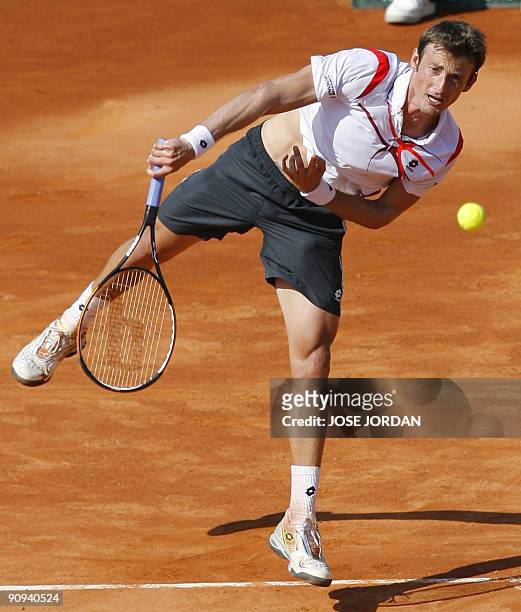 Spanish Juan Carlos Ferrero returns the ball to Israeli Dudi Sela during the second match of the Davis Cup semi-final tie between defending champions...