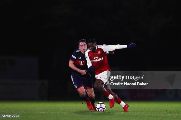 Adrian Fein of Bayern Munich battles for posession with Josh Da Silva of Arsenal during the Premier League International Cup match between Arsenal...