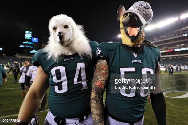 Beau Allen and Chris Long of the Philadelphia Eagles celebrates their teams win while wearing a dog masks over the Minnesota Vikings in the NFC...