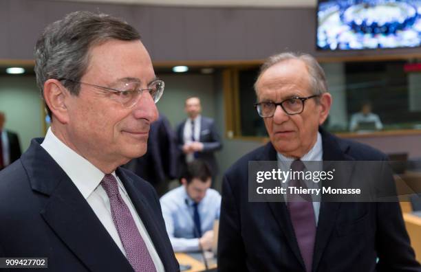 President of the European Central Bank Mario Draghi is talking with the Italian Minister Economy & Finance Pier Carlo Padoan prior an € Ministers...