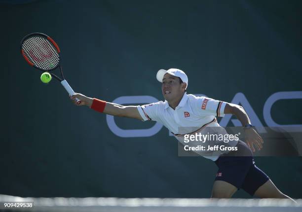 Kei Nishikori of Japan lunges to return a forehand to Dennis Novikov during the first round of the Oracle Challenger Series at the Newport Beach...