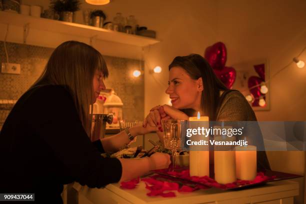 lesbian couple celebrating valentine's day - photos of lesbians kissing stock pictures, royalty-free photos & images