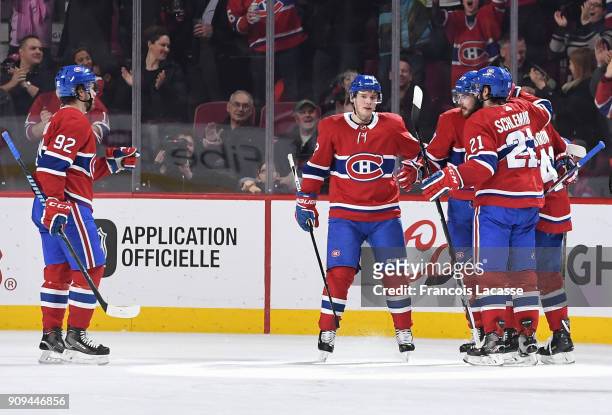 Alex Galchenyuk of the Montreal Canadiens celebrates with teammates after scoring a goal against the Colorado Avalanche in the NHL game at the Bell...