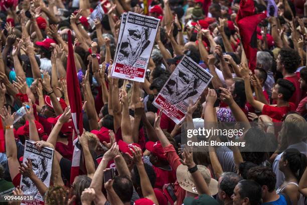 Demonstrators raises their hands during a rally in support of former President Luiz Inacio Lula da Silva, not pictured, ahead of his appeal hearing...