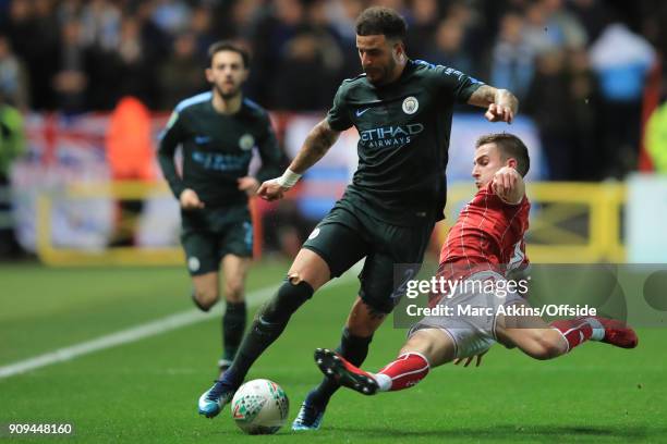 Kyle Walker of Manchester City in action with Joe Bryan of Bristol City during the Carabao Cup Semi-Final 2nd leg match between Bristol City and...