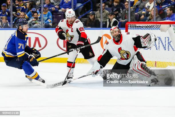 St. Louis Blues' Vladimir Sobotka, left, looks to push a loose puck past Ottawa Senators goaltender Craig Anderson, right, while under pressure by...