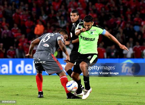 Jonny Mosquera of America de Cali vies for the ball with Andres Perez of Deportivo Cali during the match between America de Cali and Deportivo Cali...