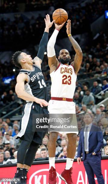 LeBron James of the Cleveland Cavaliers scores his 30,001 point over Danny Green of the San Antonio Spurs at AT&T Center on January 23, 2018 in San...