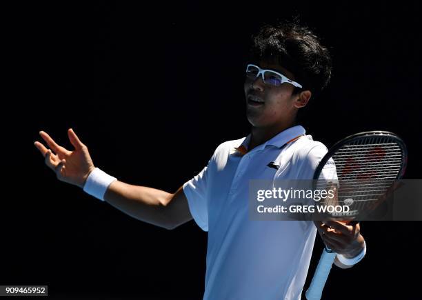 South Korea's Hyeon Chung reacts to a point against Tennys Sandgren of the US during their men's singles quarter-finals match on day 10 of the...