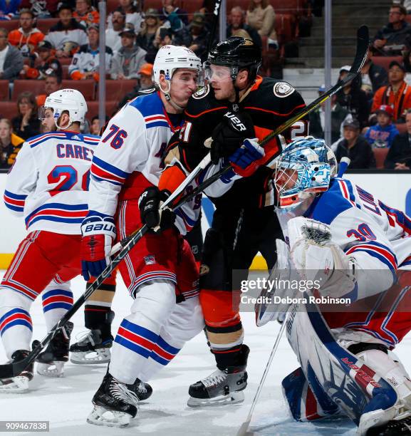 Chris Wagner of the Anaheim Ducks battles in front of the net against Brady Skjei and Henrik Lundqvist of the New York Rangers during the game on...