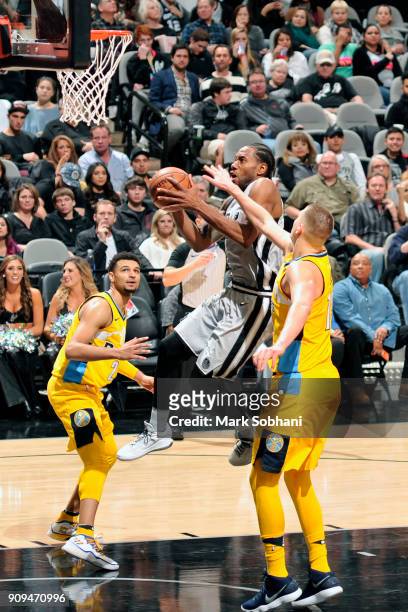 Kawhi Leonard of the San Antonio Spurs drives to the basket against the Denver Nuggets on January 13, 2018 at the AT&T Center in San Antonio, Texas....