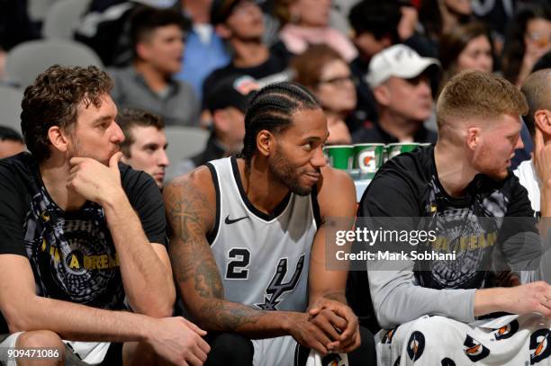 Pau Gasol of the San Antonio Spurs, Kawhi Leonard of the San Antonio Spurs, and Davis Bertans of the San Antonio Spurs look on against the Denver...