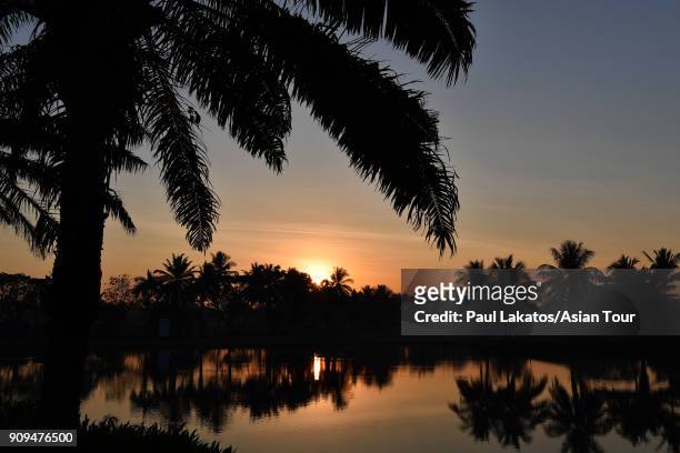 The sun rises over the 18th hole pond during the Pro am event ahead of the Leopalace21 Myanmar Open at Pun Hlaing Golf Club on January 24, 2018 in...