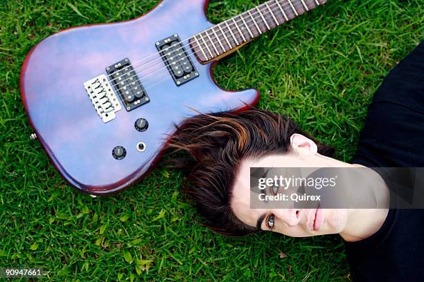 musical dreaming - emo guy stock pictures, royalty-free photos & images