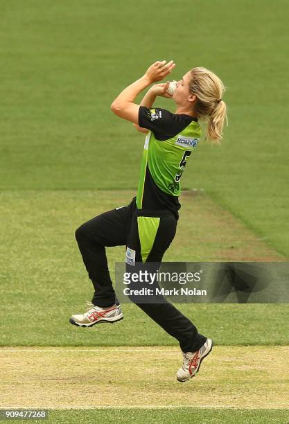 Nicola Carey of the Thunder bowls during the Women's Big Bash League match between the Sydney Thunder and the Melbourne Renegades at Manuka Oval on...