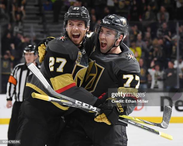 Shea Theodore and Brad Hunt of the Vegas Golden Knights celebrate after Hunt scored a second-period goal against the Columbus Blue Jackets during...